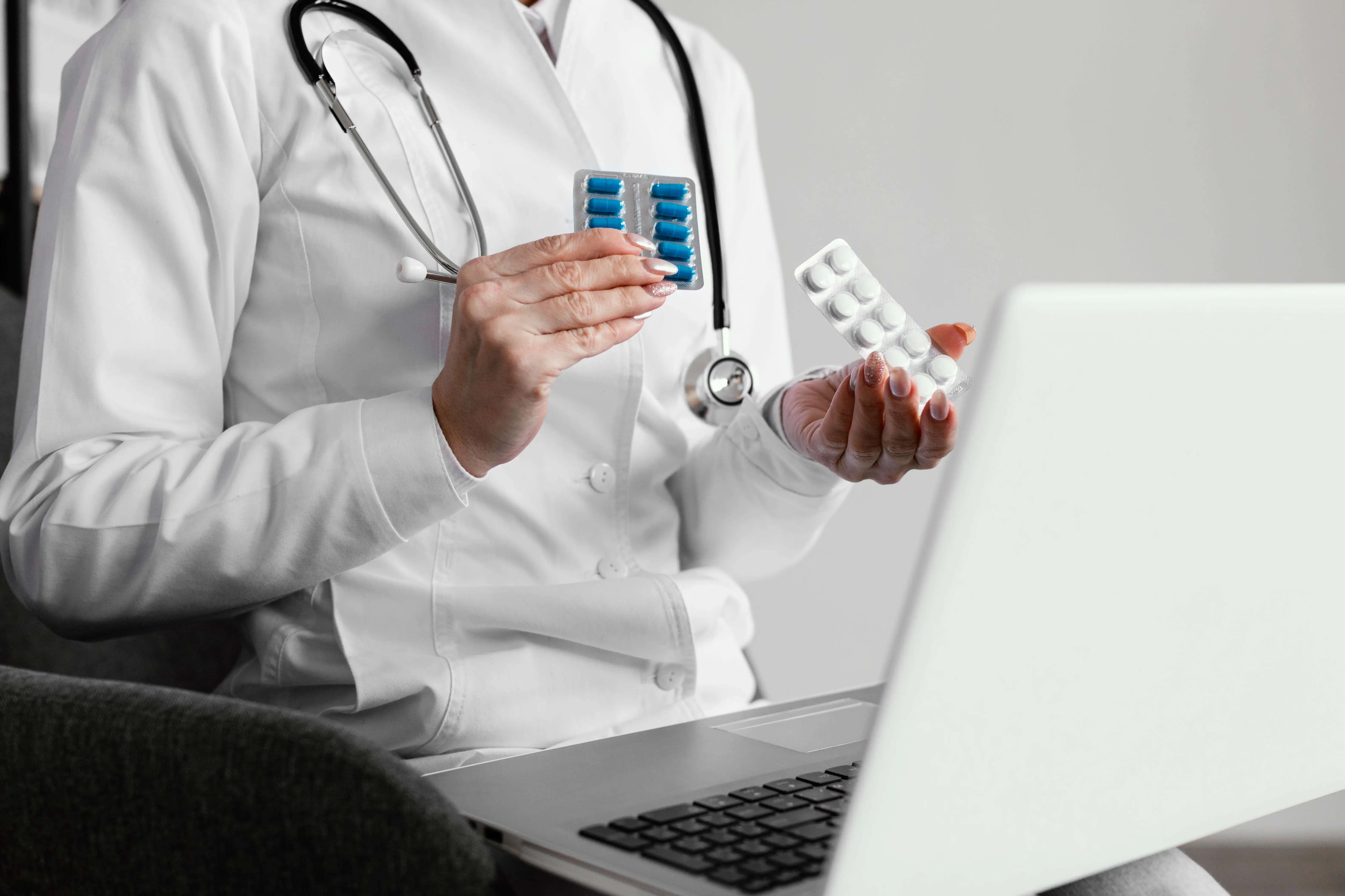 doctor with laptop and medicine